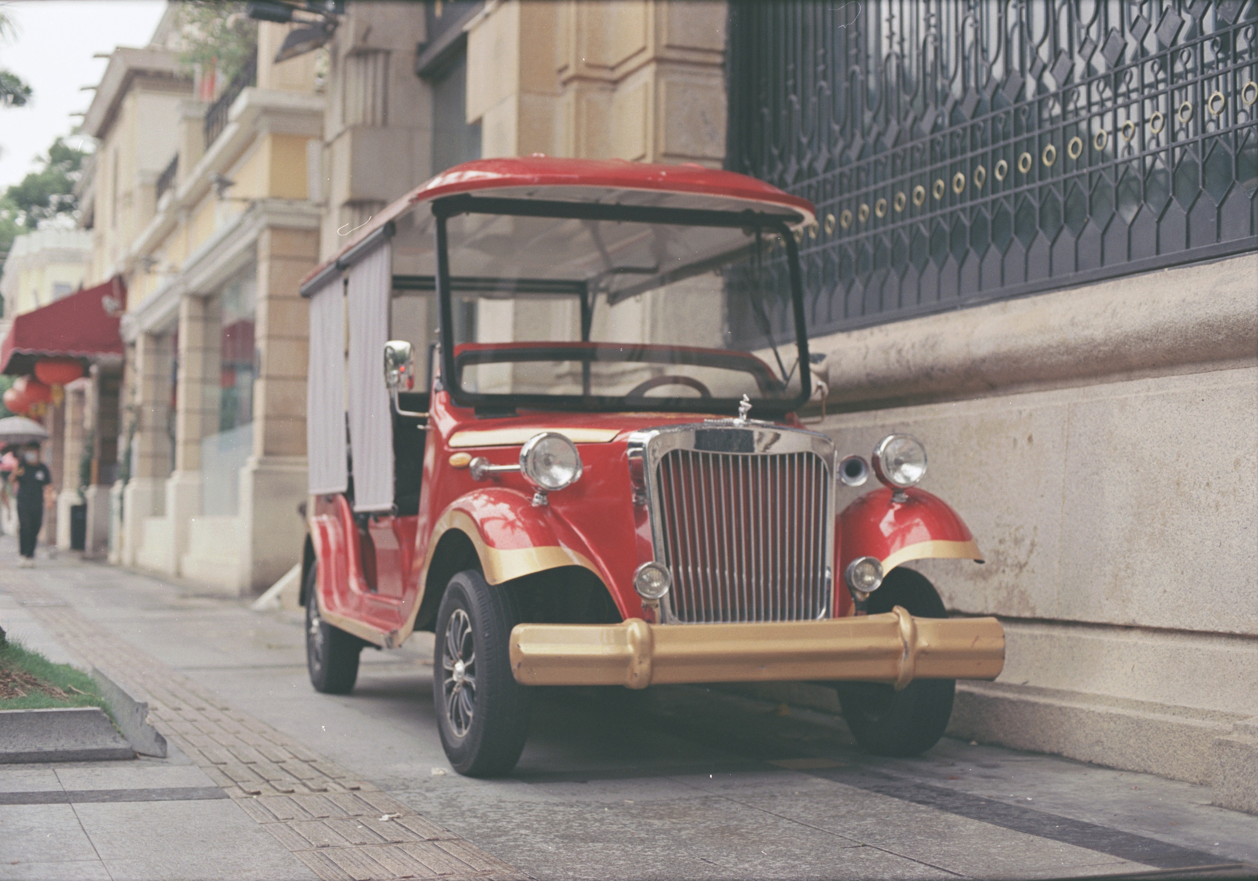 a red bus parked on the side of a street